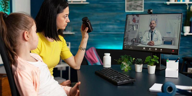 What is Remote Patient Monitoring Software A patient at home connected to a doctor via a tablet